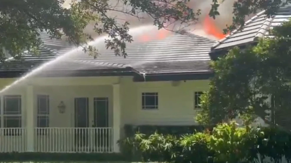 Firefighters battle large house fire in Delray Beach